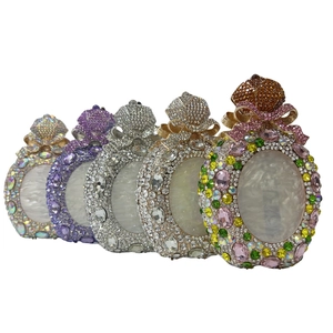 Luxurious perfume bottle evening bags with sparkling crystals and pearl shell inlay