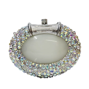 Elegant oval rhinestone clutch bag with large opal center stone for wedding party