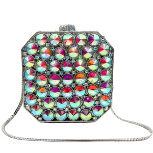 Detail of octagonal crystal clutch bag with colorful rhinestones and silver chain strap