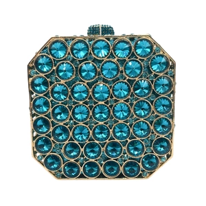Detailed view of the luxury light blue rhinestone clutch with elegant gold metal frame