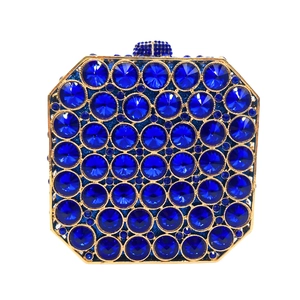 Close-up of luxury dark blue crystal stones on a square evening clutch bag