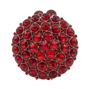 Macro detail of luxury round evening clutch featuring red crystals and gold metal frame