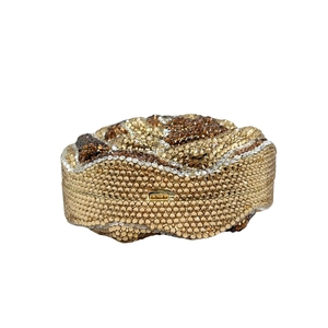 Detailed macro view of a floral bud evening clutch bag with leopard crystal embellishments