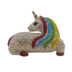 Sparkling unicorn evening clutch bag with colorful rhinestones on a white background
