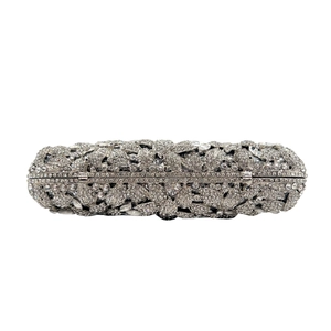 Detailed close-up of luxurious silver flower clutch with sparkling crystal rhinestones