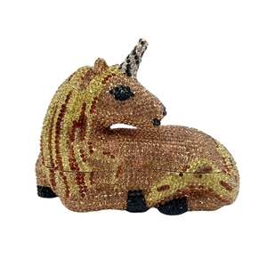 Luxury unicorn shaped evening clutch bag encrusted with golden and amber rhinestones
