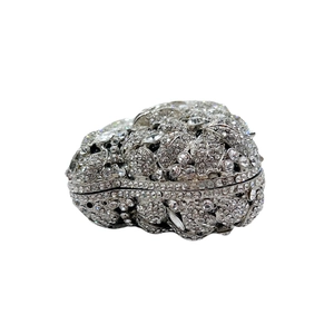 Detailed macro view of silver flower evening bag with hand-set crystals and rhinestones