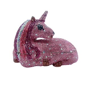 Detailed view of pink and purple gradient rhinestones on unicorn-shaped clutch bag