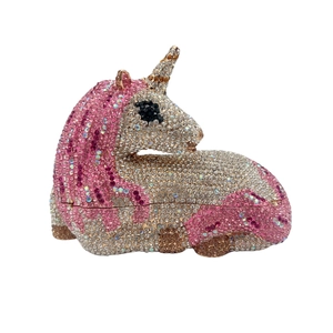 Macro detail of hand-set pink and white rhinestones on the unicorn evening clutch bag