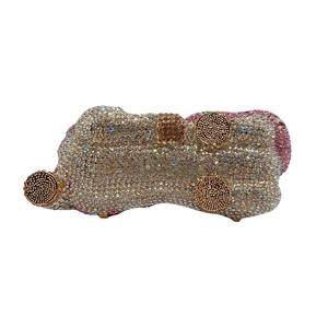 Detailed base view of crystal horse clutch showing protective gold metal feet studs