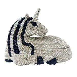 Detailed close-up of handmade luxury unicorn clutch with colorful rhinestones and crystal inlay