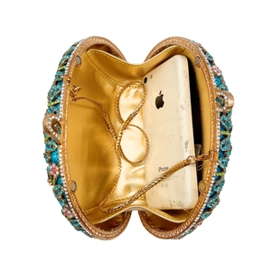 Floral rhinestone evening clutch with blue crystals and gold chain strap interior view
