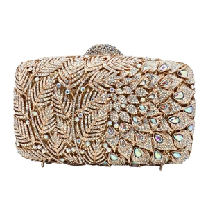 Detailed view of luxury gold crystal evening clutch with leaf pattern and rhinestone finish