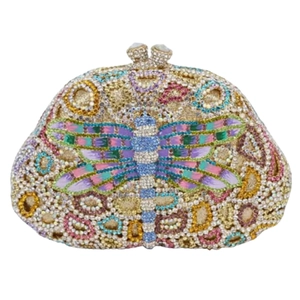 Macro detail of luxury dragonfly clutch bag featuring colorful hand-set rhinestones