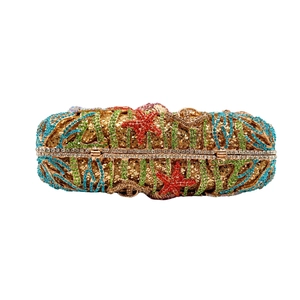 Ocean themed rhinestone evening clutch with starfish and sea grass crystal patterns