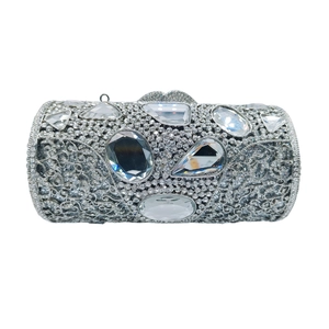 Sparkling silver cylindrical evening clutch bag with rhinestones and large crystals