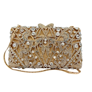 Elegant gold evening clutch with silver rhinestones, bow clasp and metal chain strap