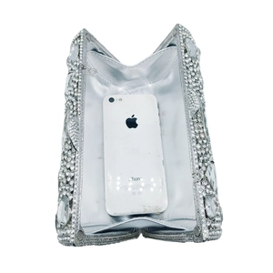Elegant silver rhinestone clutch bag with hollow metal frame and interior phone storage
