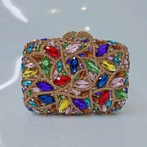 Detail of hollow metal frame evening clutch with colorful marquise crystal rhinestones