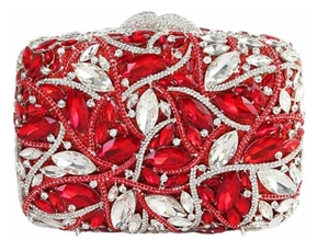 Close-up of red and silver rhinestones on a metal hollow-out evening clutch bag