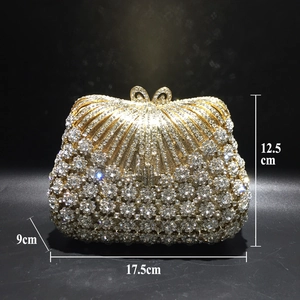 Detailed dimensions of gold evening clutch bag featuring rhinestone floral pattern and bow clasp