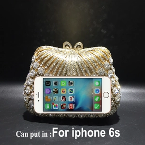 Detail view of gold rhinestone shell clutch evening bag with capacity for iPhone 6s