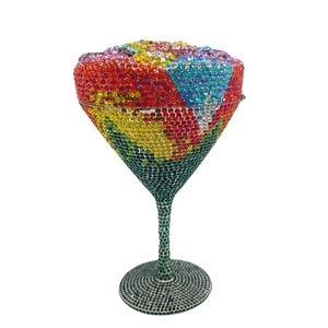 Macro detail of martini glass clutch bag with colorful rhinestones and metal stem