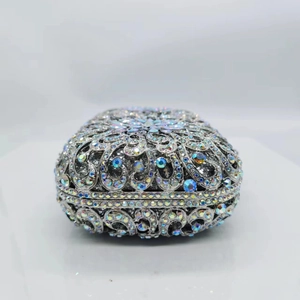Macro detail of hollow metal clutch with colorful rhinestones and sparkling crystals