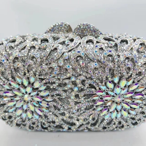 Luxury silver hollow metal clutch bag with sparkling crystals and floral gemstone design