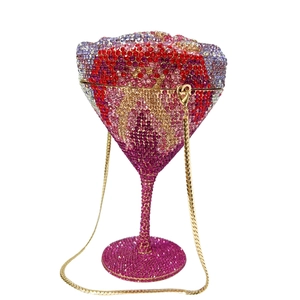 Detail of martini cup clutch bag with red-purple gradient crystals and gold chain