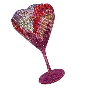 Detailed close-up of heart-shaped crystal evening clutch bag with gradient rhinestones