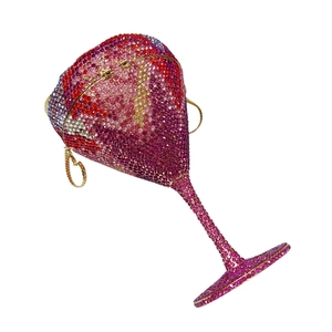 Macro detail of martini cup clutch bag with pink gradient rhinestones and gold chain