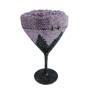 Detail of martini glass clutch bag with purple and black rhinestones for evening parties