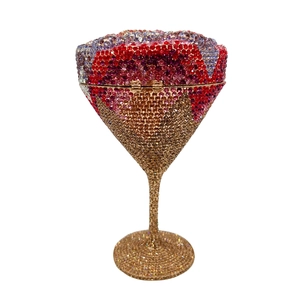 Macro detail of martini glass clutch bag with luxury rhinestones and gold metal frame