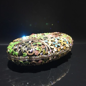 Luxurious oval evening clutch bag featuring colorful floral crystal and gemstone patterns