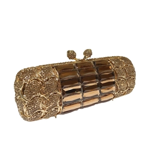 Clutch da sera dorata con strass giallo limone e accenti in pietre preziose ambra