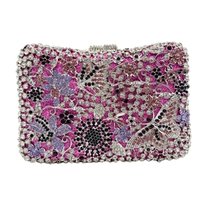 Luxurious hollow flower crystal clutch bag with pink butterfly rhinestones on white background