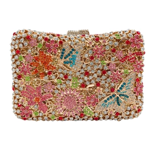 Detail of crystal clutch bag with colorful floral and butterfly rhinestone patterns