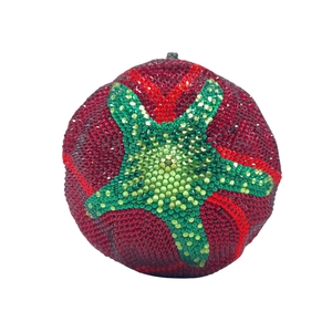 Detailed view of tomato-shaped crystal evening clutch bag with full red and green rhinestones