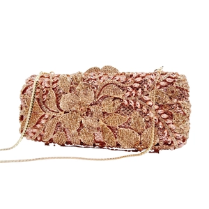Champagne rose gold evening clutch bag with floral rhinestone patterns and gold chain
