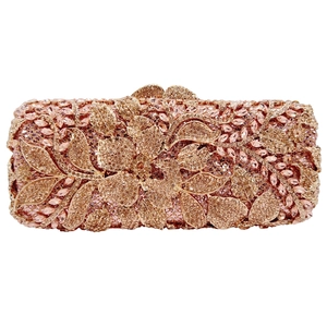 Close-up of floral rhinestone evening clutch with champagne gold crystals and intricate metalwork