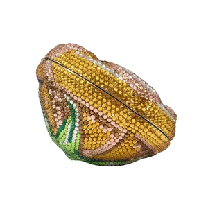 Detailed side view of round gradient crystal clutch bag with secure clasp closure