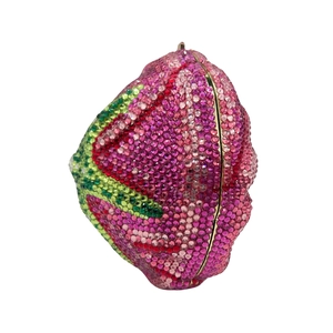 Macro view of crystal encrusted rose bud clutch bag with pink and green rhinestones
