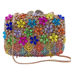 Detailed view of the luxury evening clutch with floral rhinestones and gold chain