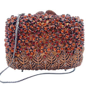 Detail of amber crystal lilac flower evening clutch with diamond encrusted petals