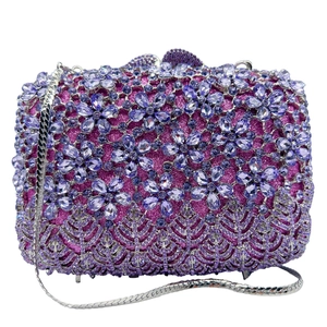 Detail of purple lilac crystal evening clutch bag with sparkling diamond floral patterns