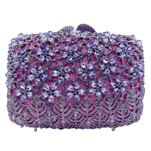 Detailed view of the sparkling floral crystal pattern and rhinestones on the luxury clutch