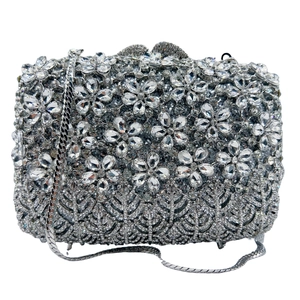 Detailed close-up of lilac floral rhinestone clutch bag with sparkling diamond patterns