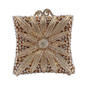 Sparkling rhinestone evening bag with sunburst pattern and golden metal frame