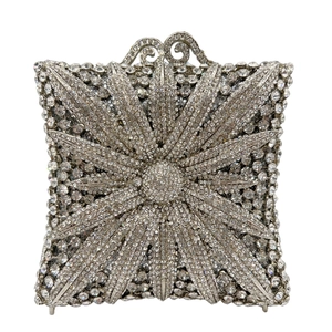 Macro detail of silver floral rhinestone evening bag with sparkling crystal star pattern